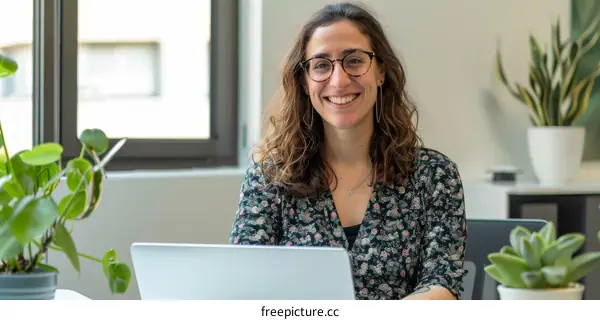 Portrait of a young woman smiling in an office