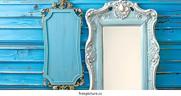 Blue Ornate Frames Against Distressed Wooden Background