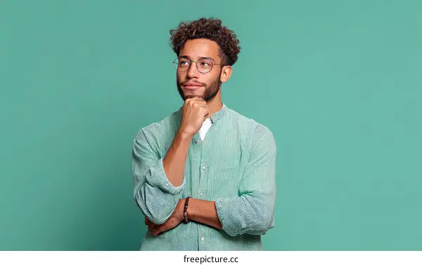 Thoughtful Man in Light Green Shirt