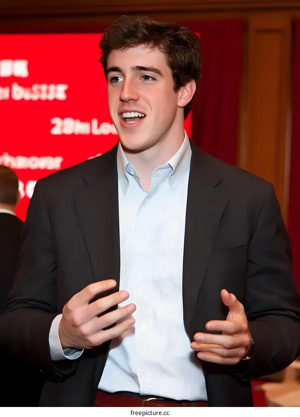Young Man Speaking at a Conference or Event