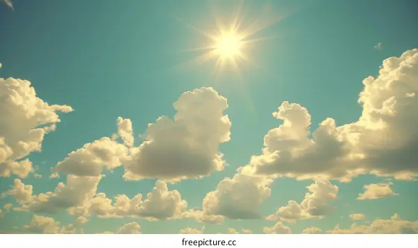 Blue sky with white clouds and shining sun