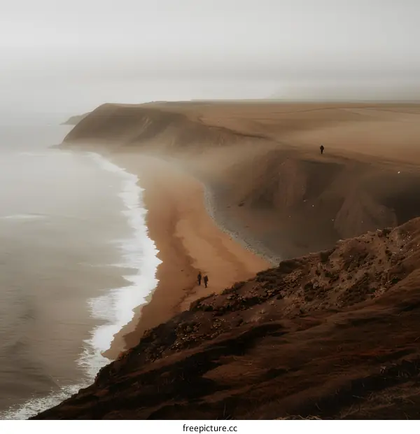Misty Beach Cliffside with Hikers