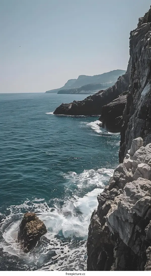 Sea Cliffs with Ocean Waves Crashing Against Rocks
