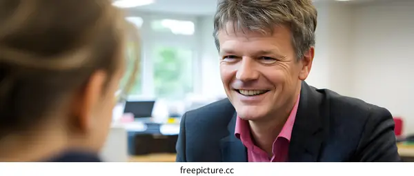 Smiling Businessman in a Meeting