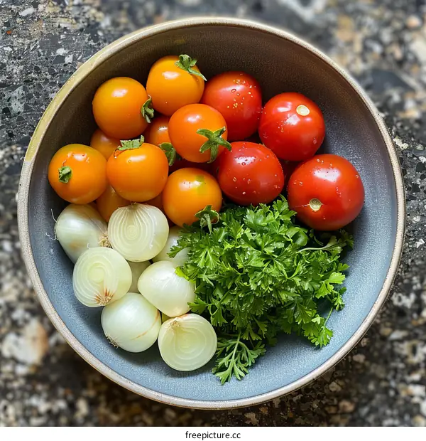 A bowl of cherry tomatoes, shallots and parsley