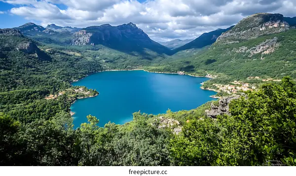 High Angle View of Turquoise Lake Surrounded by Mountains