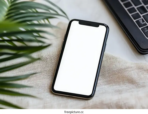 Blank Screen Smartphone with Green Plant