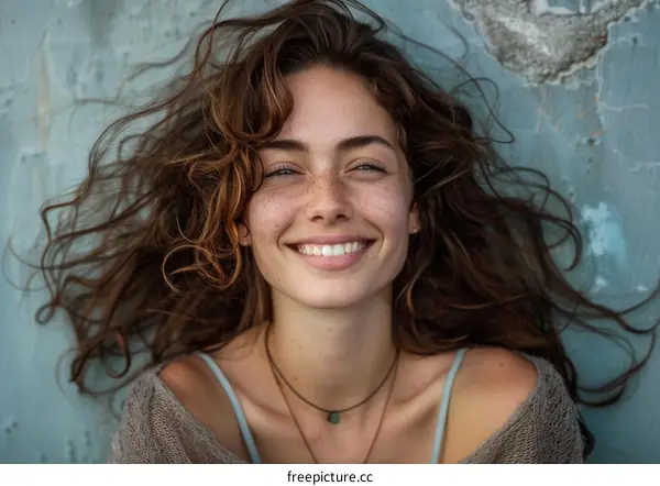 Beautiful Woman with Curly Hair Smiling Outdoor