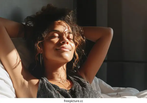 Relaxing Woman in Sunlight on Bed