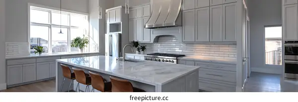 Modern Gray Kitchen with Large Windows and Island