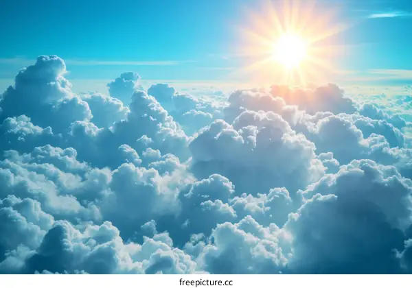 Blue sky and white clouds with sun shining through the cloudscape