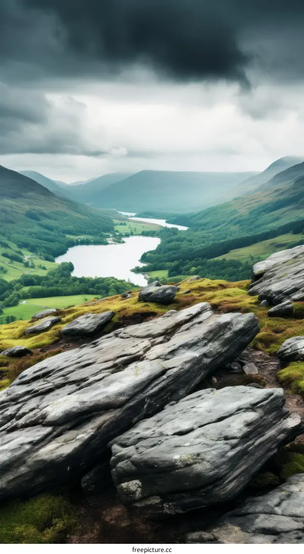 rocks in the foreground with a lake and mountains in the background