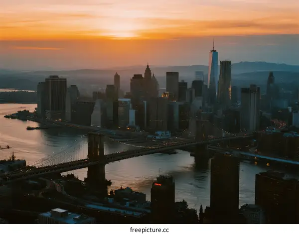 Golden Hour Over New York City Skyline with Brooklyn Bridge