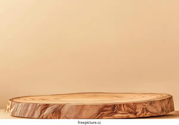 Wooden Slice Display Stand Against Beige Background