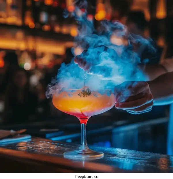 bartender preparing a smoking cocktail drink at a bar