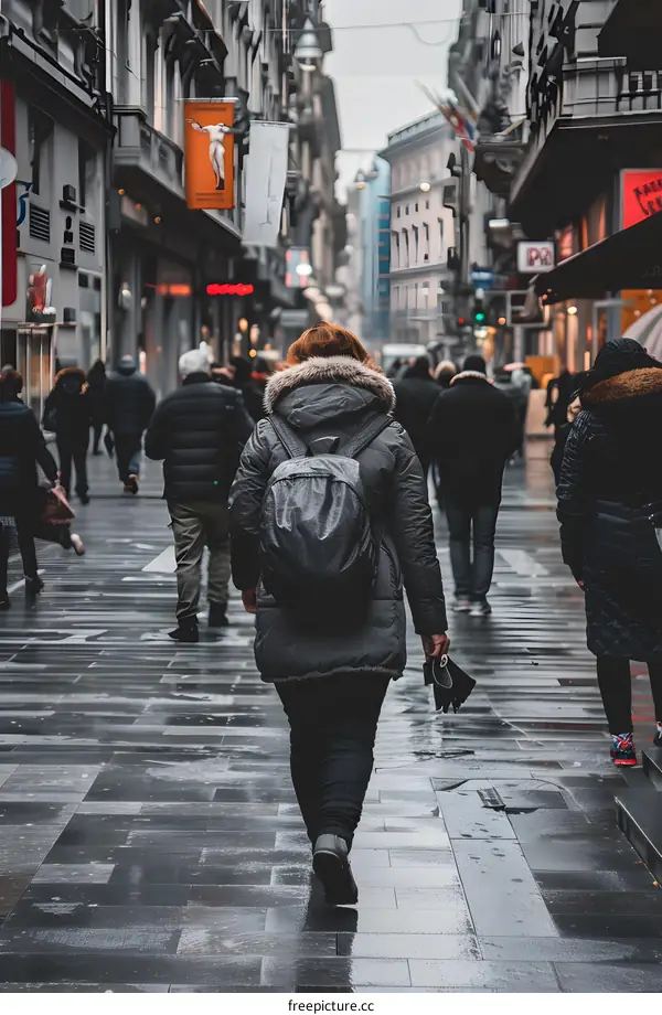 Woman Walking in the City Street on a Cloudy Day