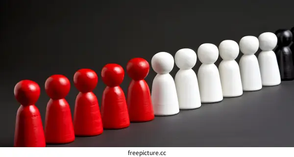 Line of Red White and Black Wooden Figures