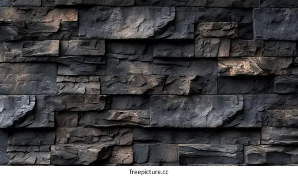 Dark stacked stone wall texture background