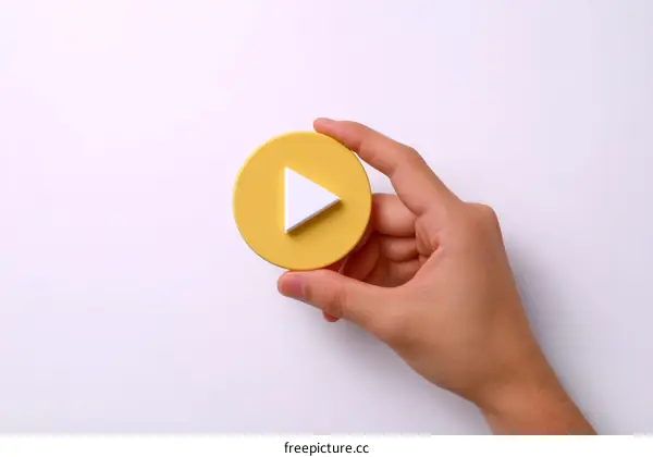 Play Button in Hand Illustration