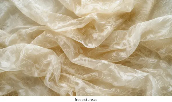 Close up of a crumpled beige floral patterned fabric