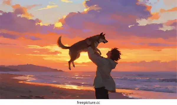 Man lifting dog in the air during beautiful sunset at beach