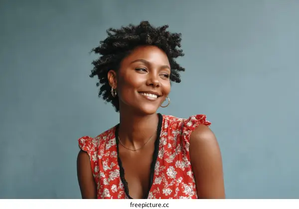Smiling Woman in a Red Floral Dress