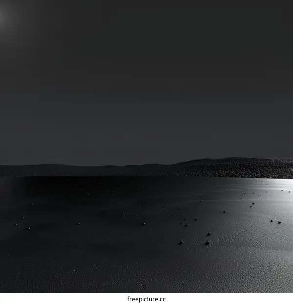 Black sand beach with dark sky