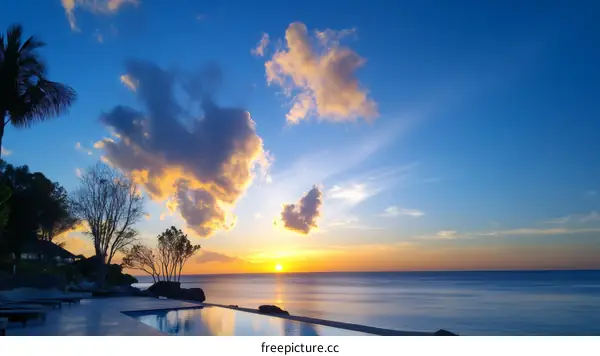 Sunset Over the Ocean with Infinity Pool