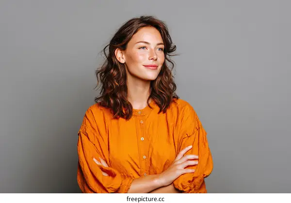 Confident Woman in an Orange Shirt