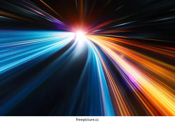 Abstract image of colorful light trails with a bright light source in the center