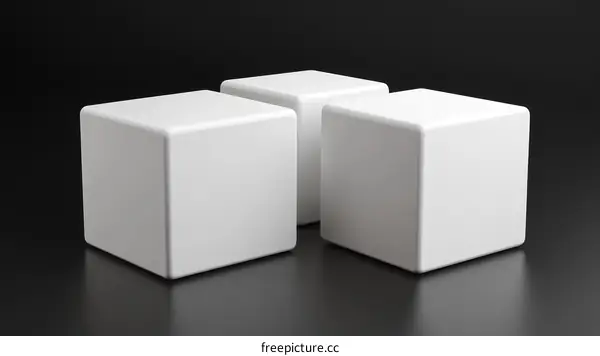 Three Blank White Cubes on Dark Background
