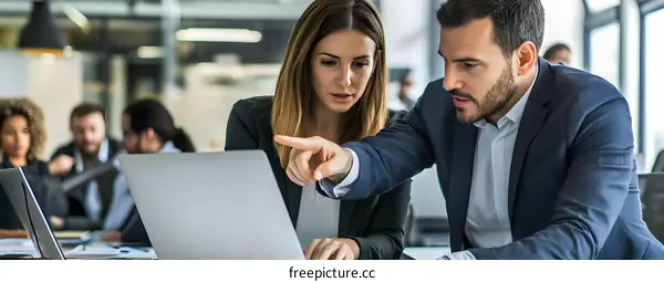 Business People Working Together On Laptop In Office