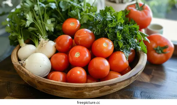 A wooden bowl filled with ripe tomatoes, onions, and parsley