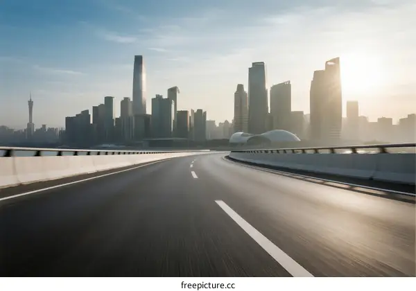 Urban road with modern city skyline in the background
