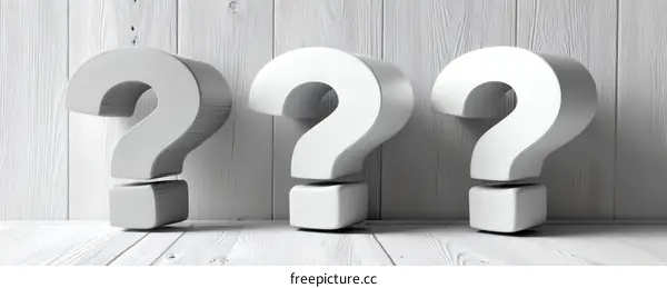 Three Dimensional Question Marks on White Wooden Background