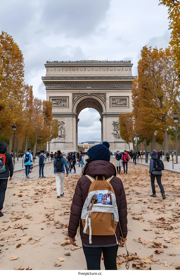 Walking Towards The Arc de Triomphe in Paris During Autumn