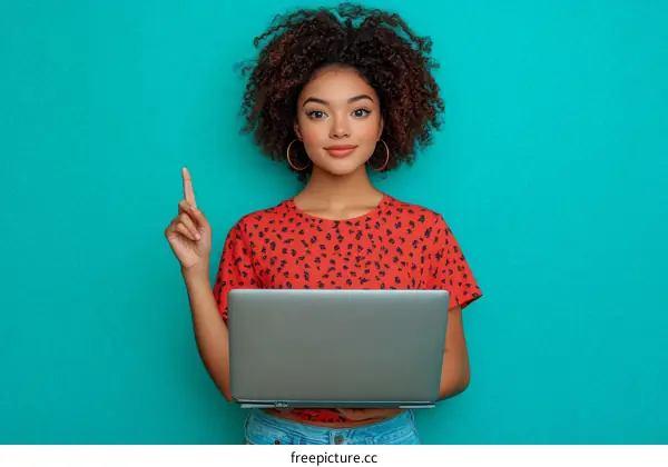 Young Woman with Laptop Points Upward