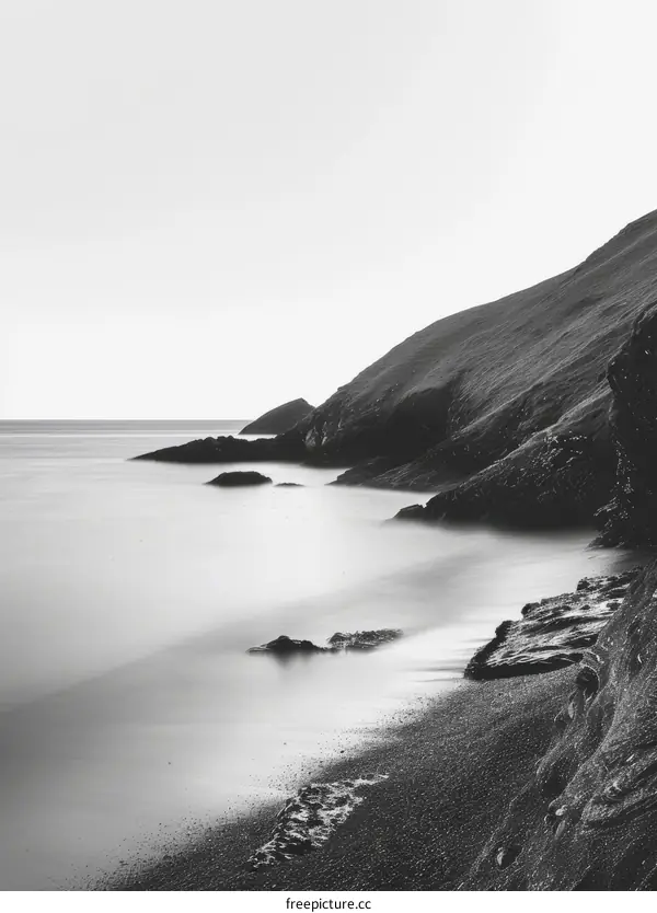 Black and white seascape with rocks and cliffs