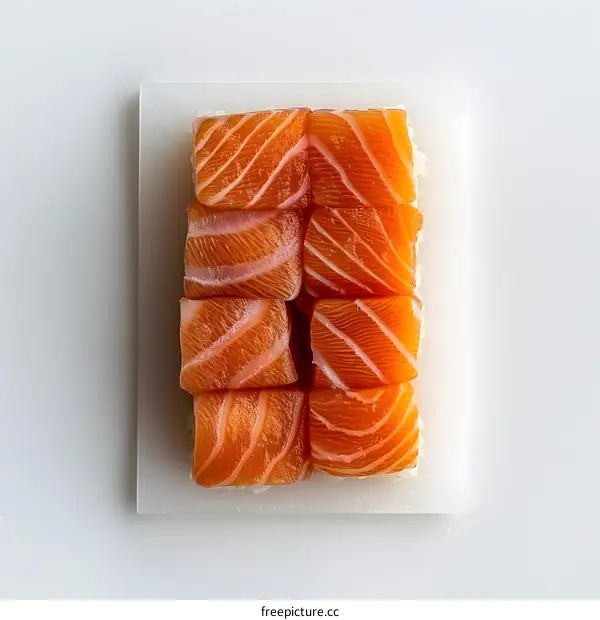 Salmon Sushi Rolls on White Surface