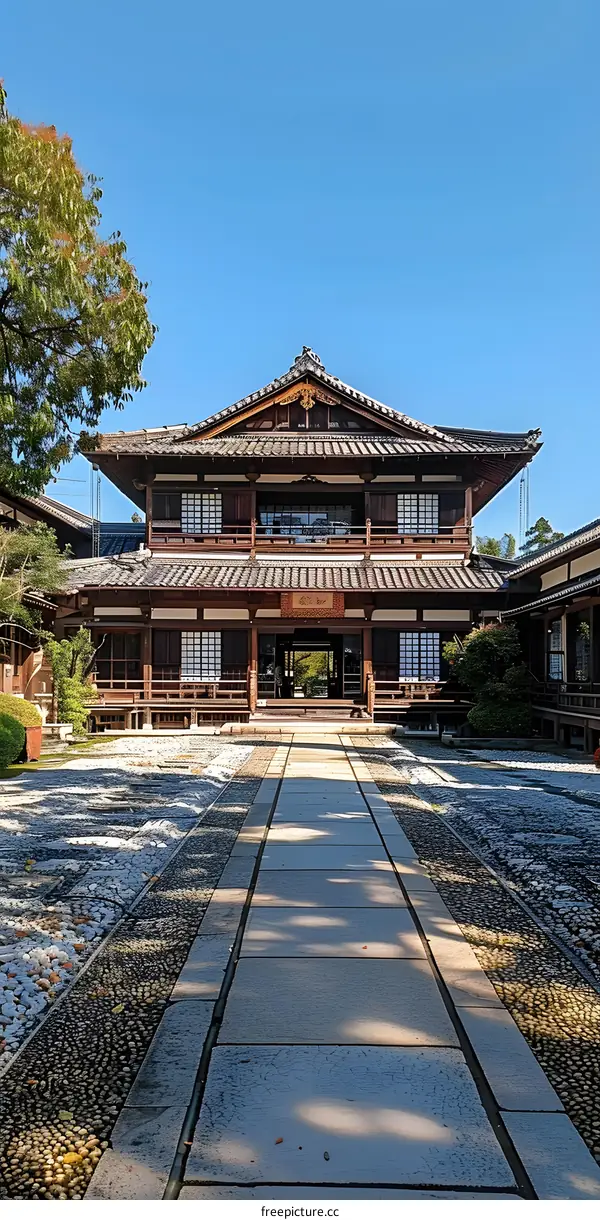 Japanese courtyard with traditional wooden house and stone path