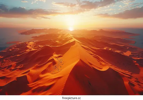 Amazing sunset over the endless red sand dunes of the Empty Quarter desert in Saudi Arabia