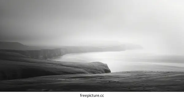 Black and white photo of a foggy seascape