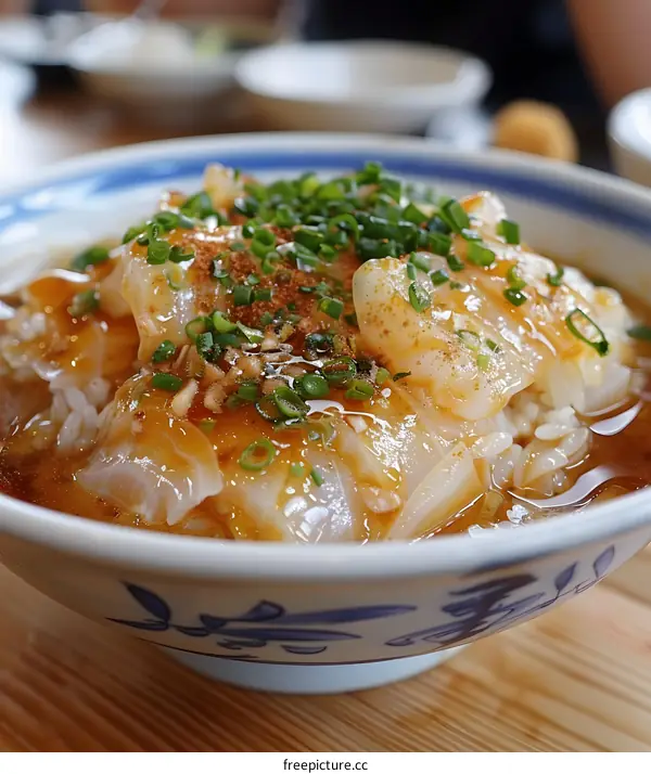 Bowl of Rice with Fish and Green Onions