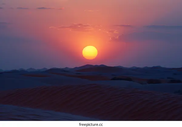 Sunset over the sand dunes in the Empty Quarter desert of Saudi Arabia