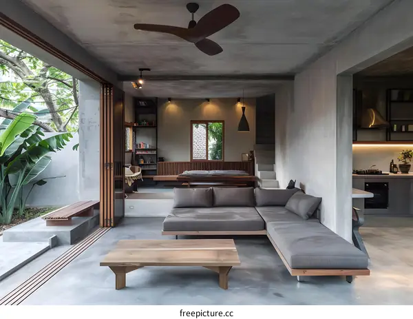 Modern Concrete House Interior Design with Open Floor Plan and Grey Sofa