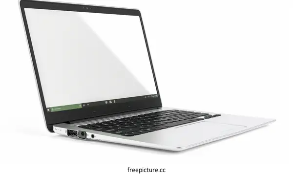 A silver laptop sits on a white table