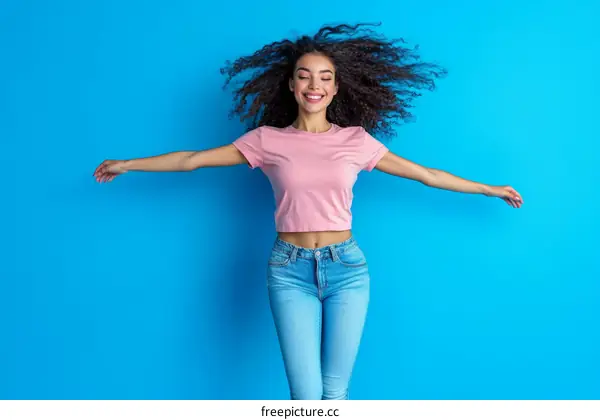 Happy African Woman in Pink Top and Jeans