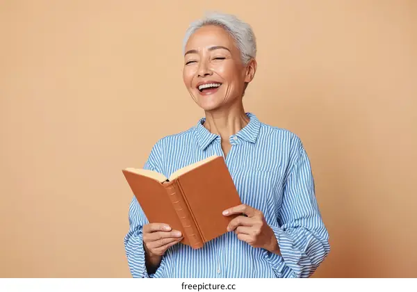 Senior Woman Reading a Book Against a Beige Background