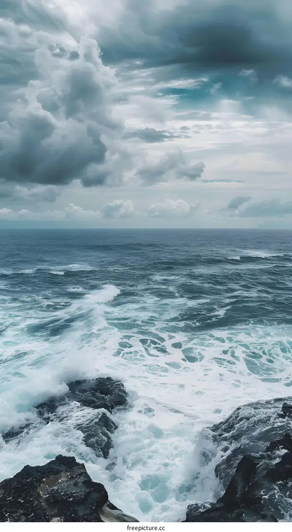 Ocean Waves Crashing on Rocks with Cloudy Sky