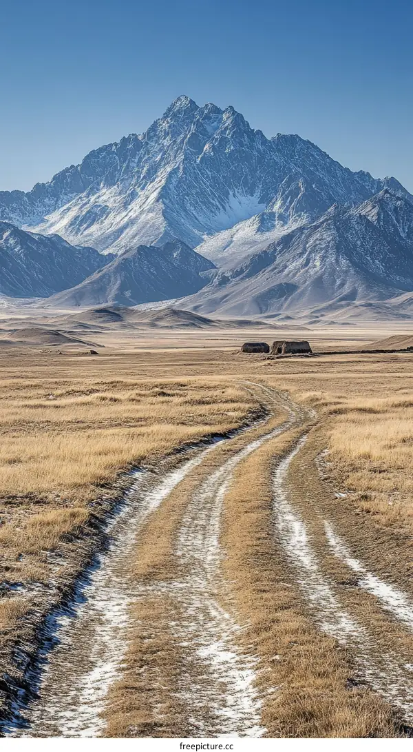 Majestic Mountain Landscape with Snowy Peaks and Dusty Road